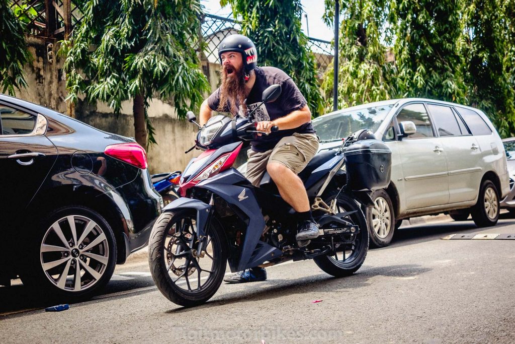 Bearded guy on a Honda Winnner