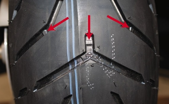 Tread wear indicators are bars that are molded into the tire, between knobs, and at the bottom of the tread grooves