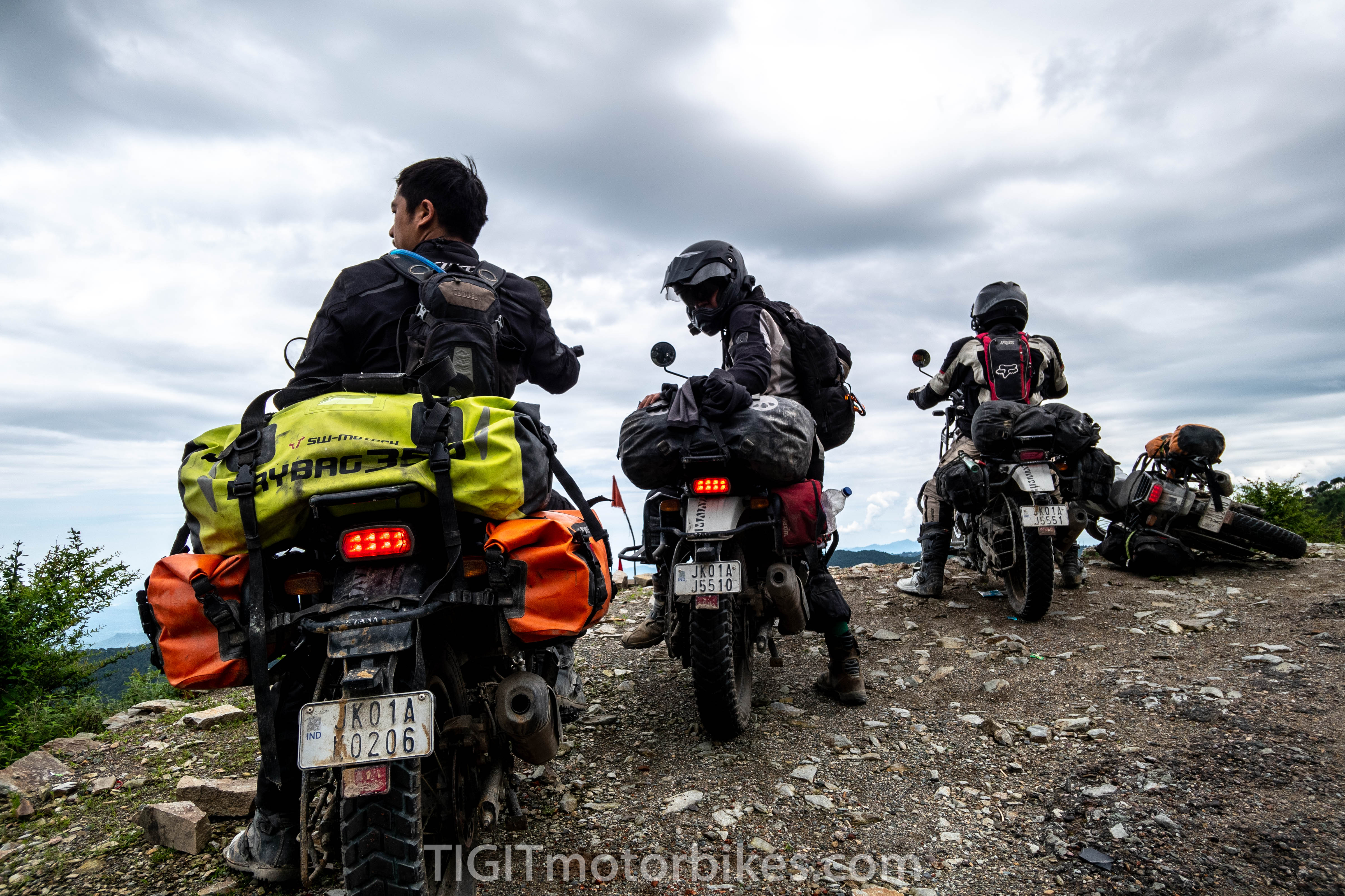 ADV riders overlooking a cliff in the Himalayas