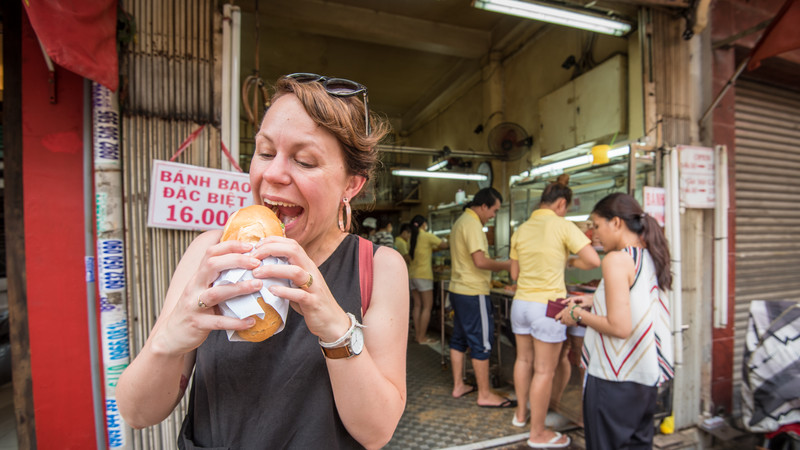 Girl eating banh mi